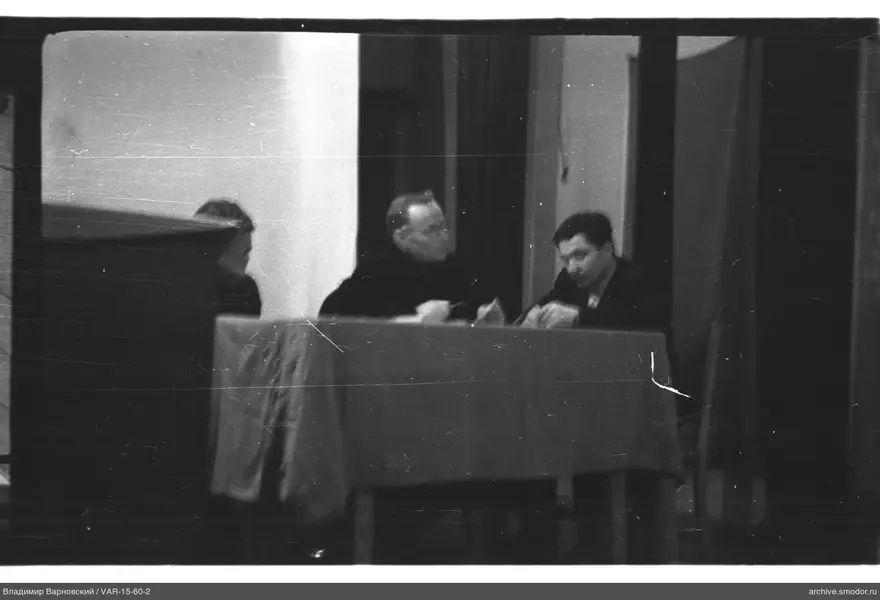 Three men at a table