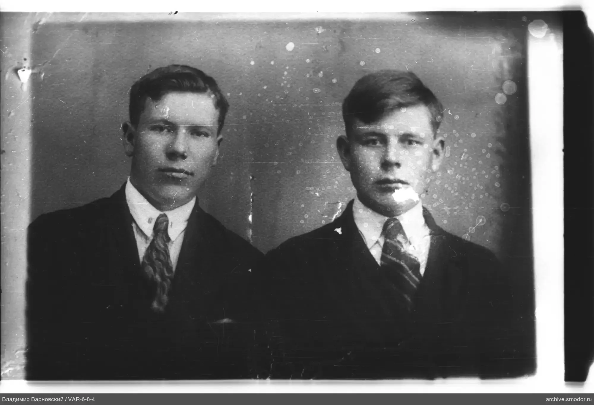 Two young men in suits and ties