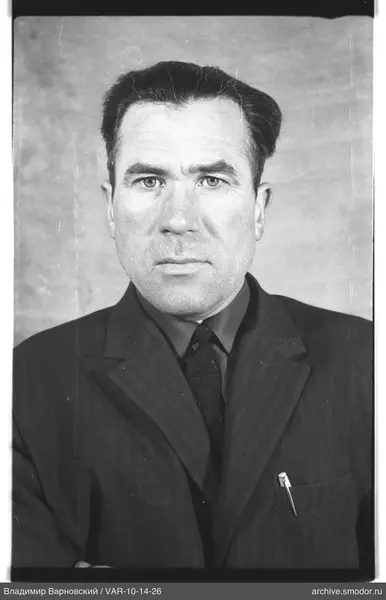 Portrait of a man in a dark suit