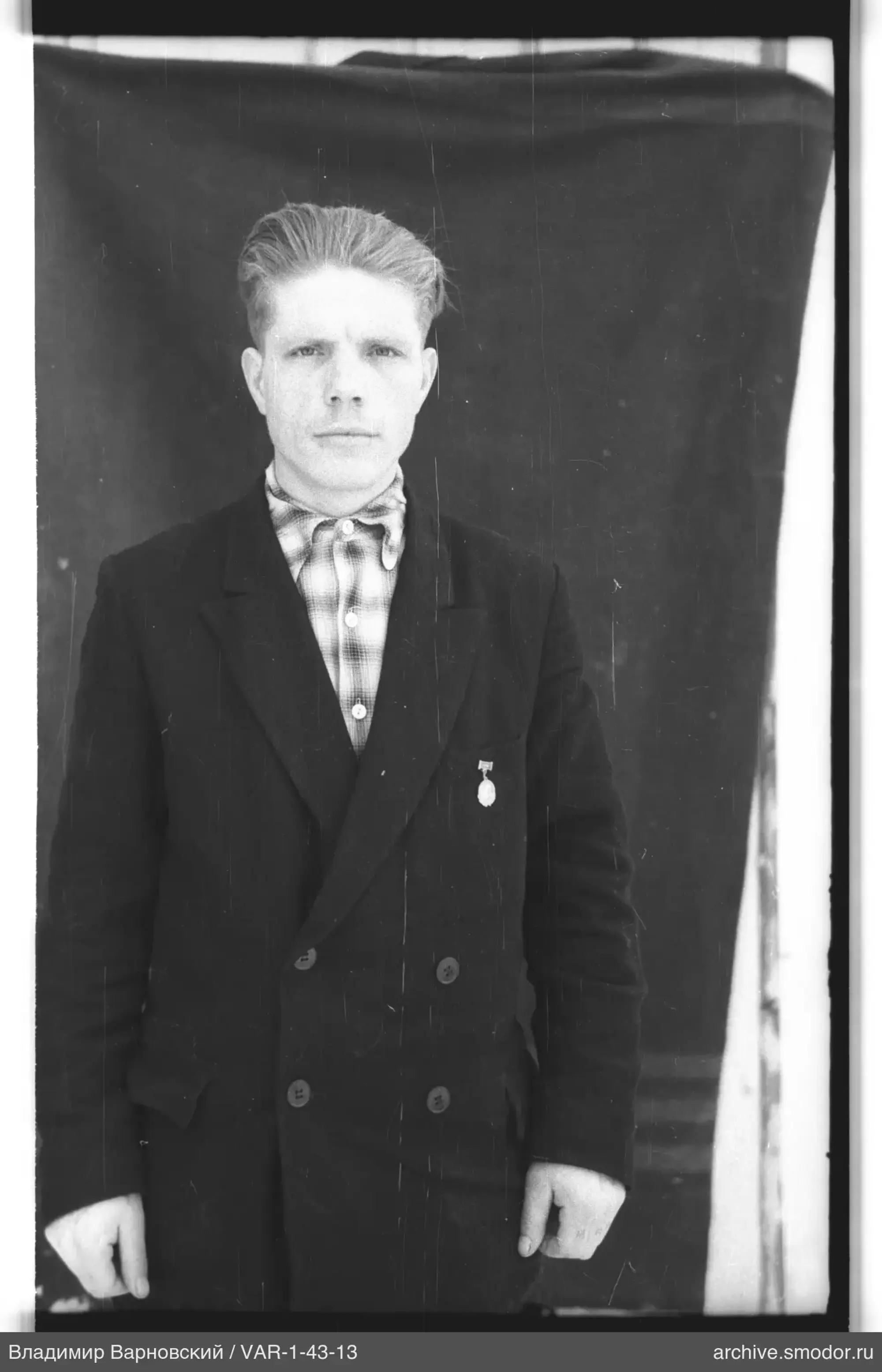 Full-length portrait of a man in a suit