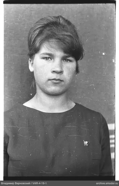 Portrait of a woman with badge on dress