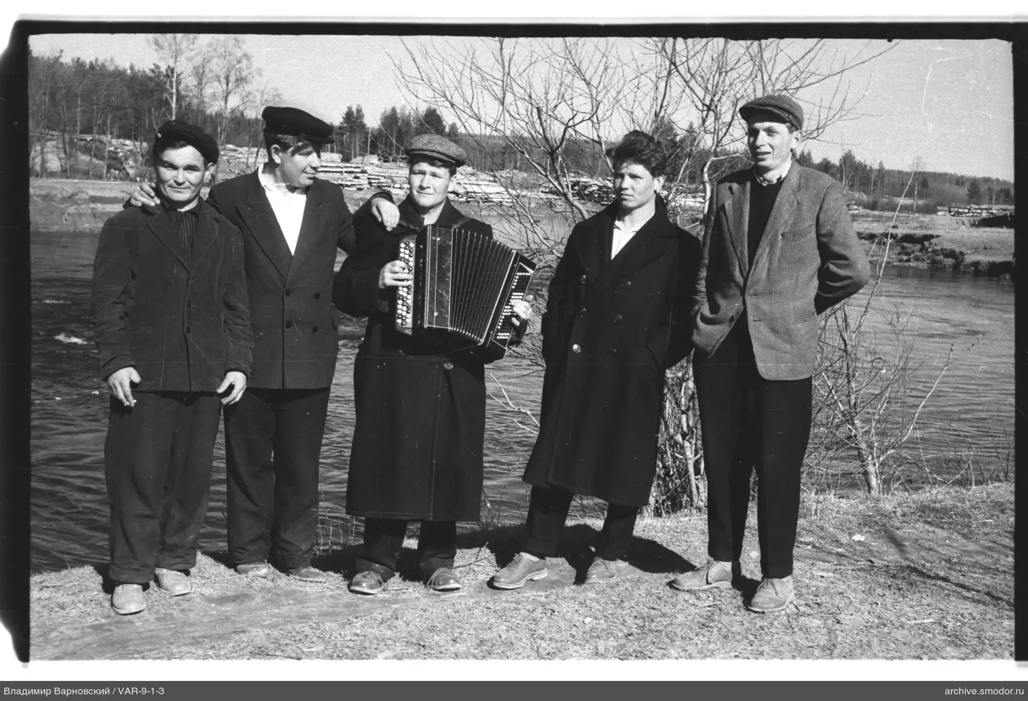 Group of men by the river