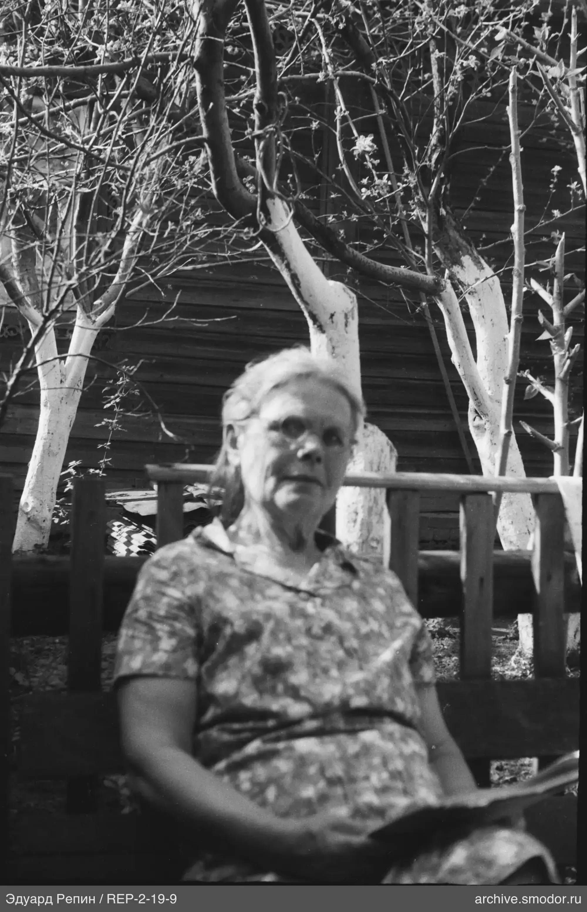 Woman with book on bench