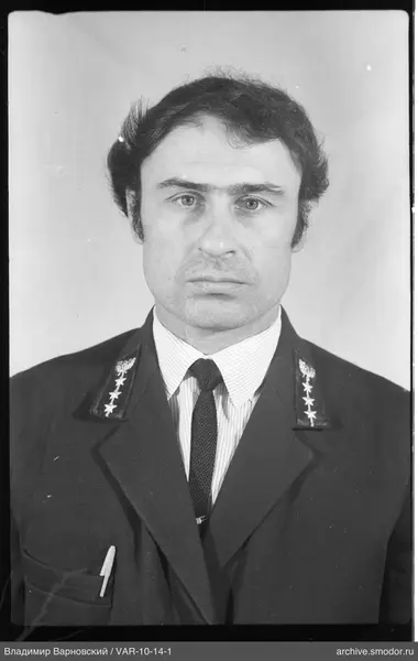 Portrait of a man in a jacket with emblems