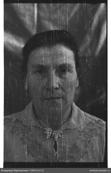 Portrait of a woman with butterfly-shaped brooch