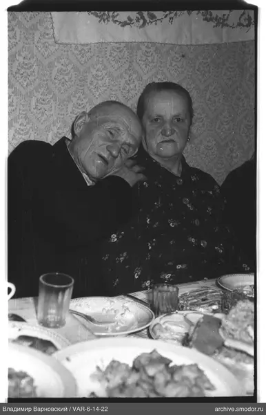 Portrait of a man and a woman at a table