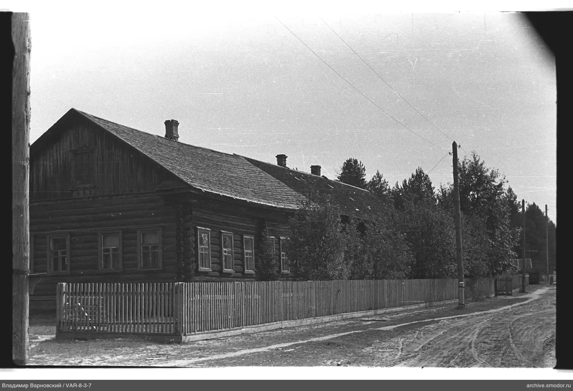Long wooden building with chimneys