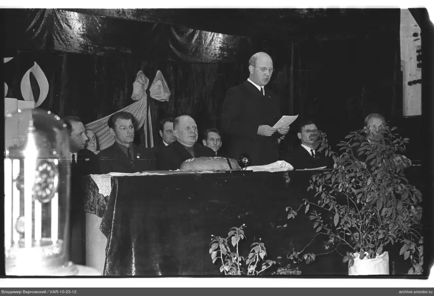 Men at a table during an event