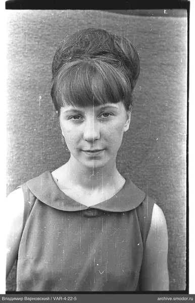 Portrait of a woman in a dress with collar