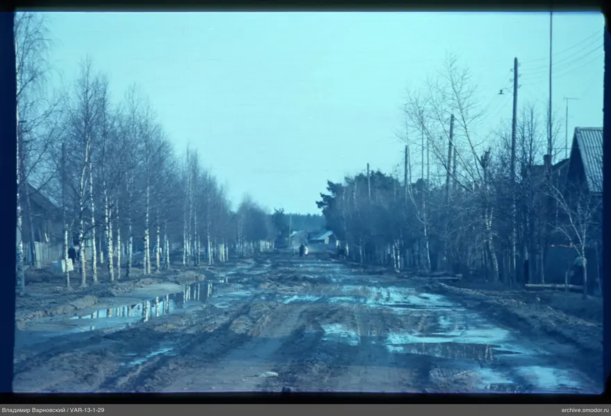 Wooden houses and road with people