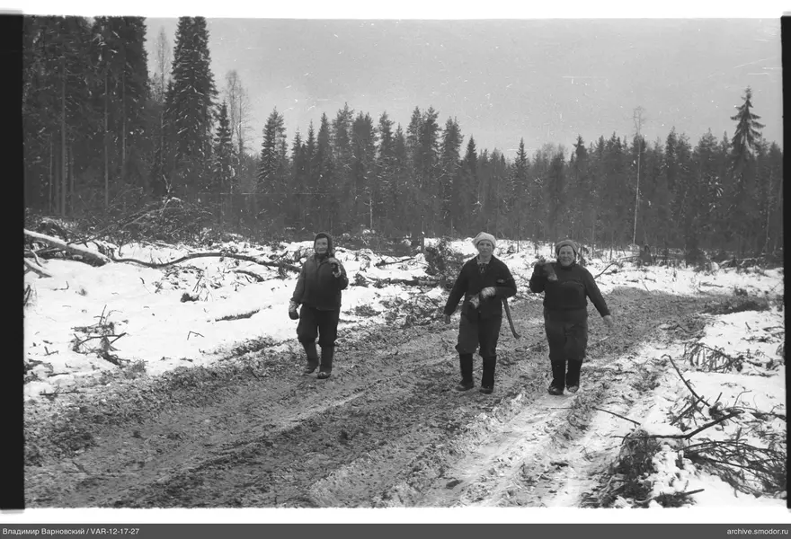 Three women with tools on the road