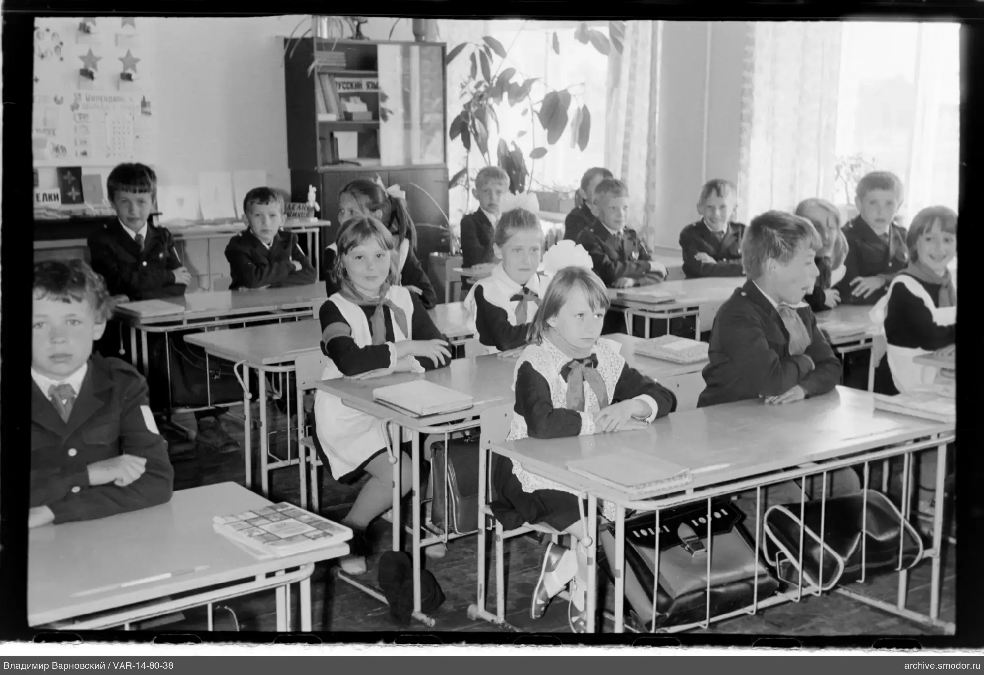Group portrait of schoolchildren in classroom