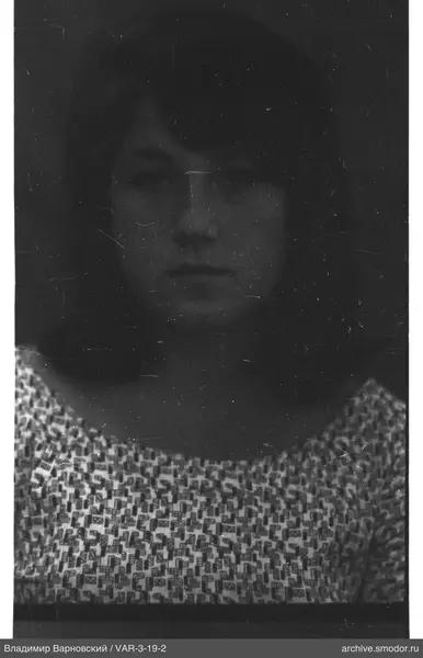 Portrait of a woman in a geometric patterned dress