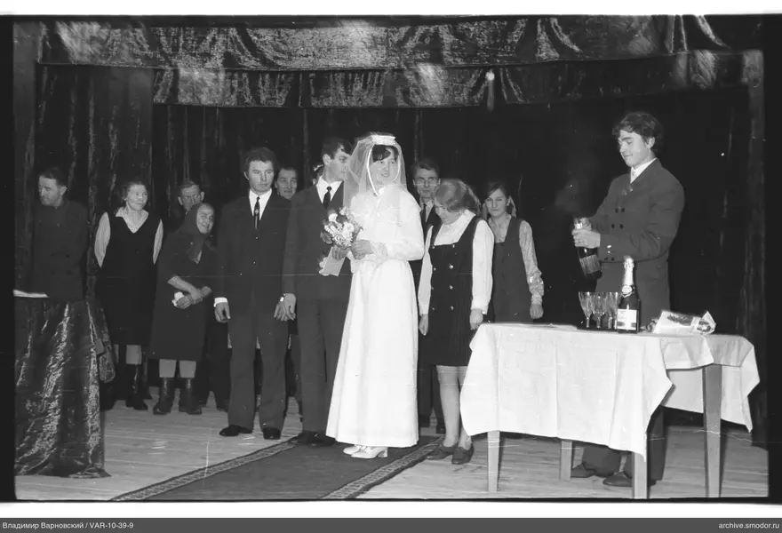 Group portrait with woman in veil and champagne