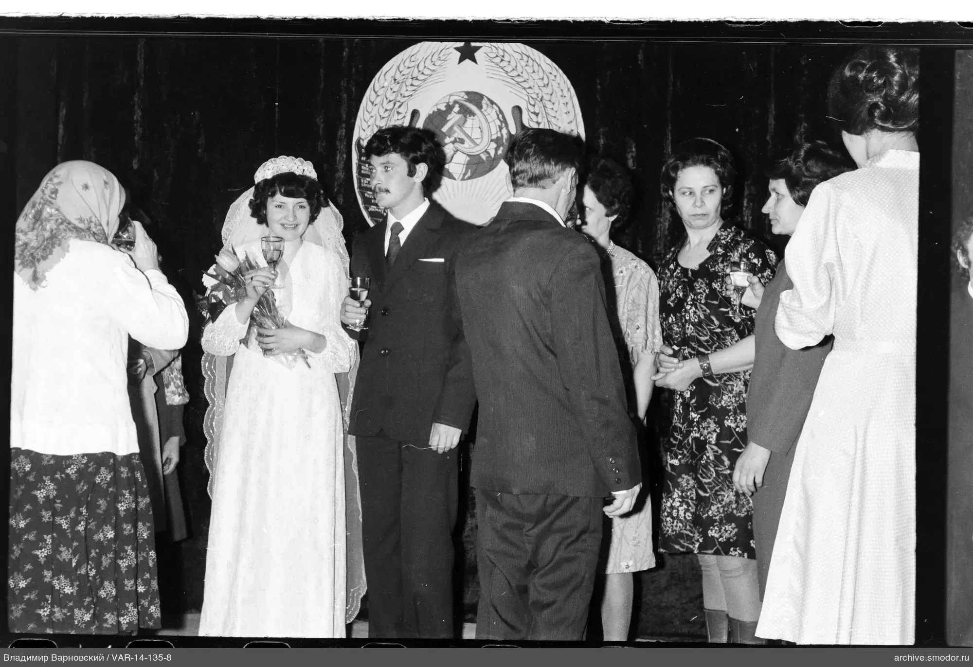 Group photo with woman in white dress