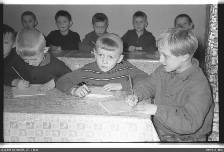 Group of boys at tables