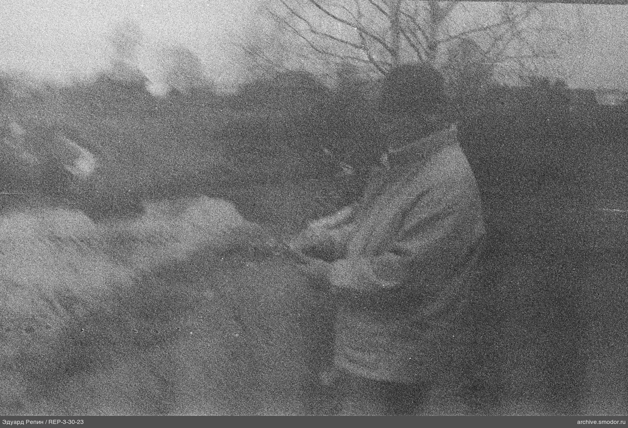 Man leaning on a wooden table