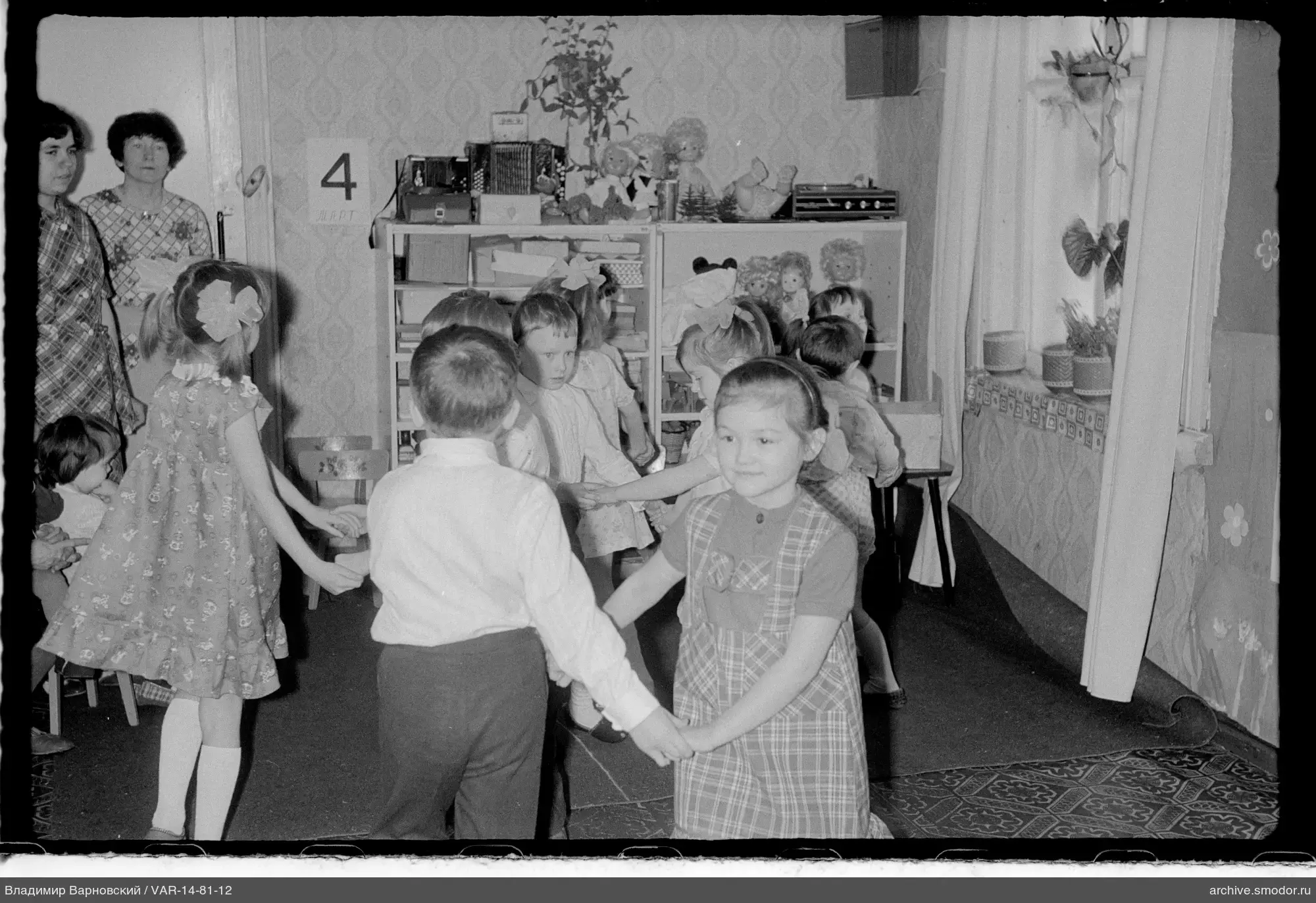Children forming a circle in a room