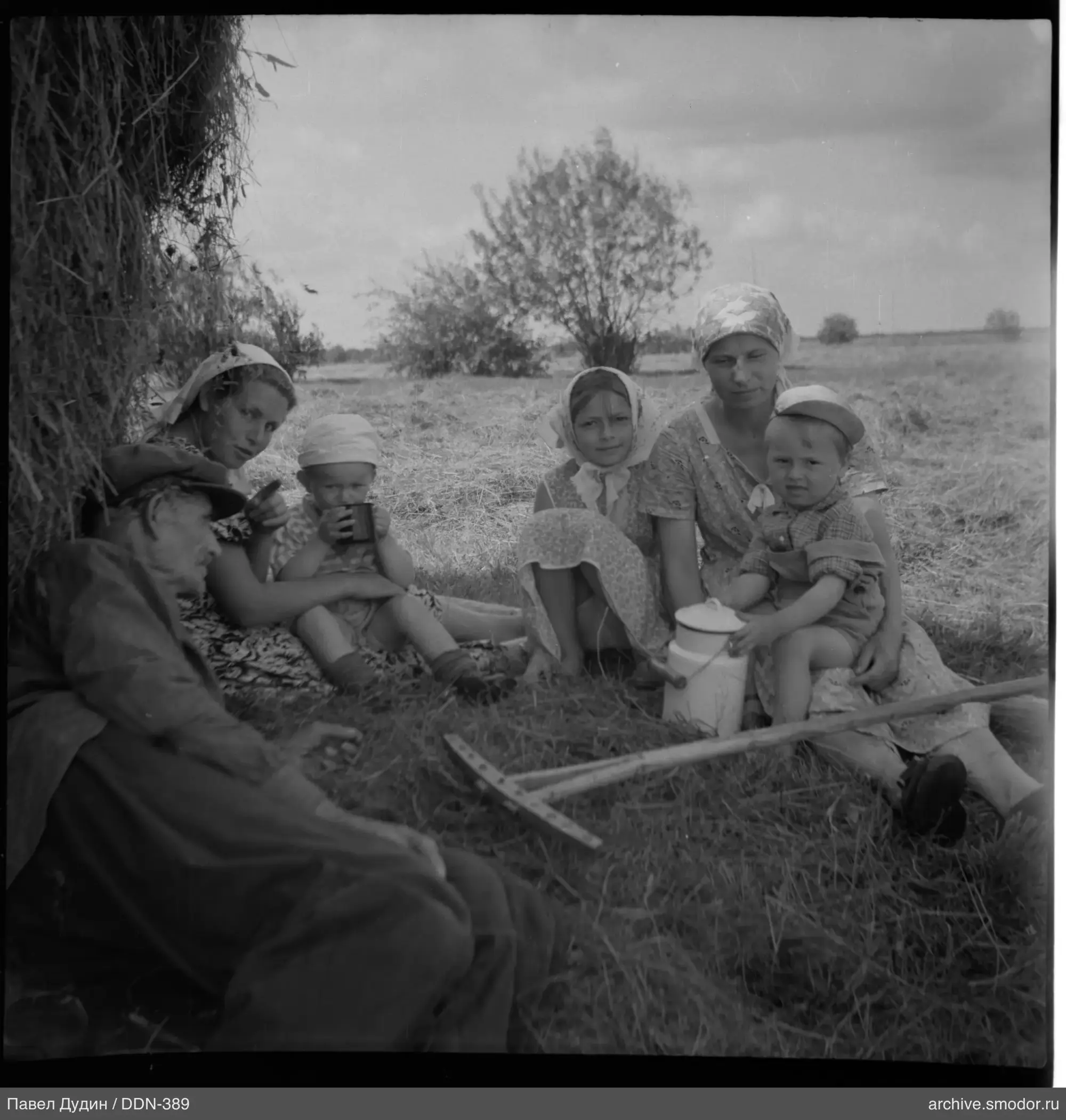 Group of people near a haystack