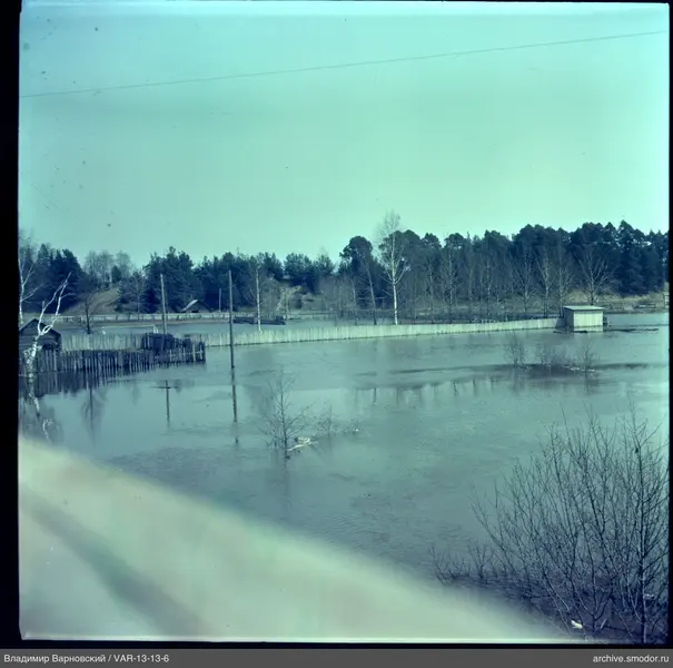 Area with wooden fence and flooded land