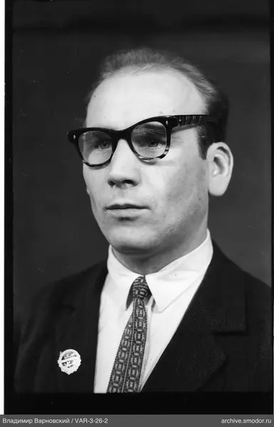 Close-up portrait of a man with badge