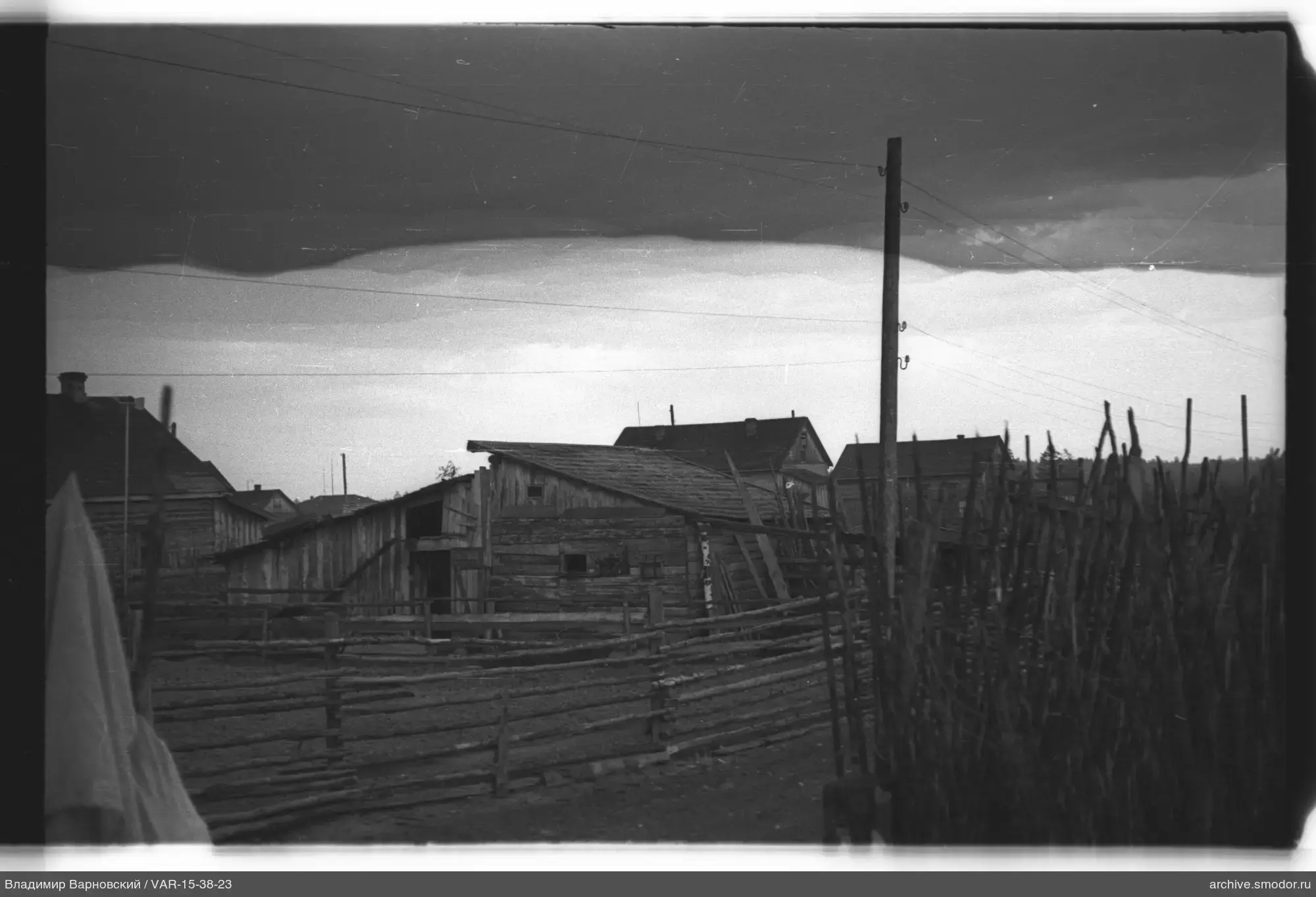 Wooden utility buildings and fence