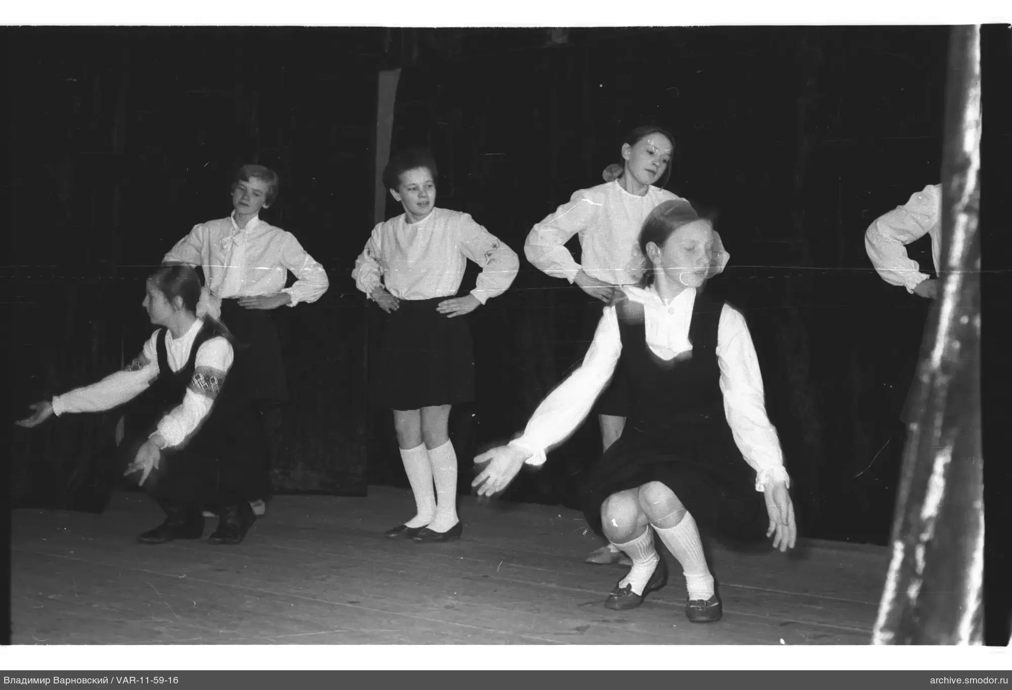 Girls in school uniforms on stage