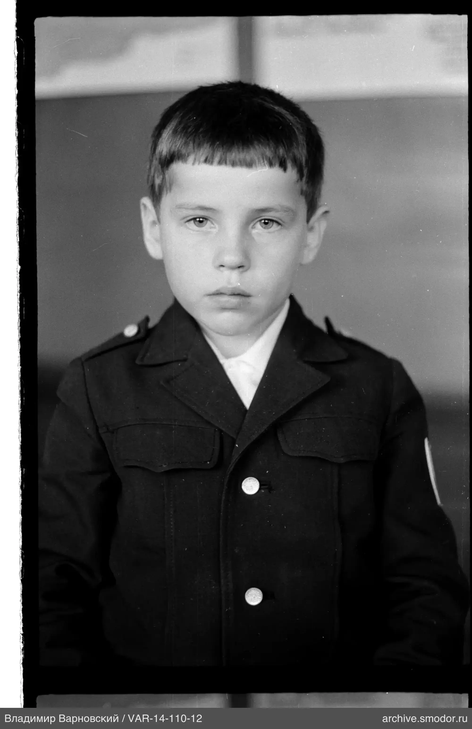 Boy's portrait in jacket and shirt