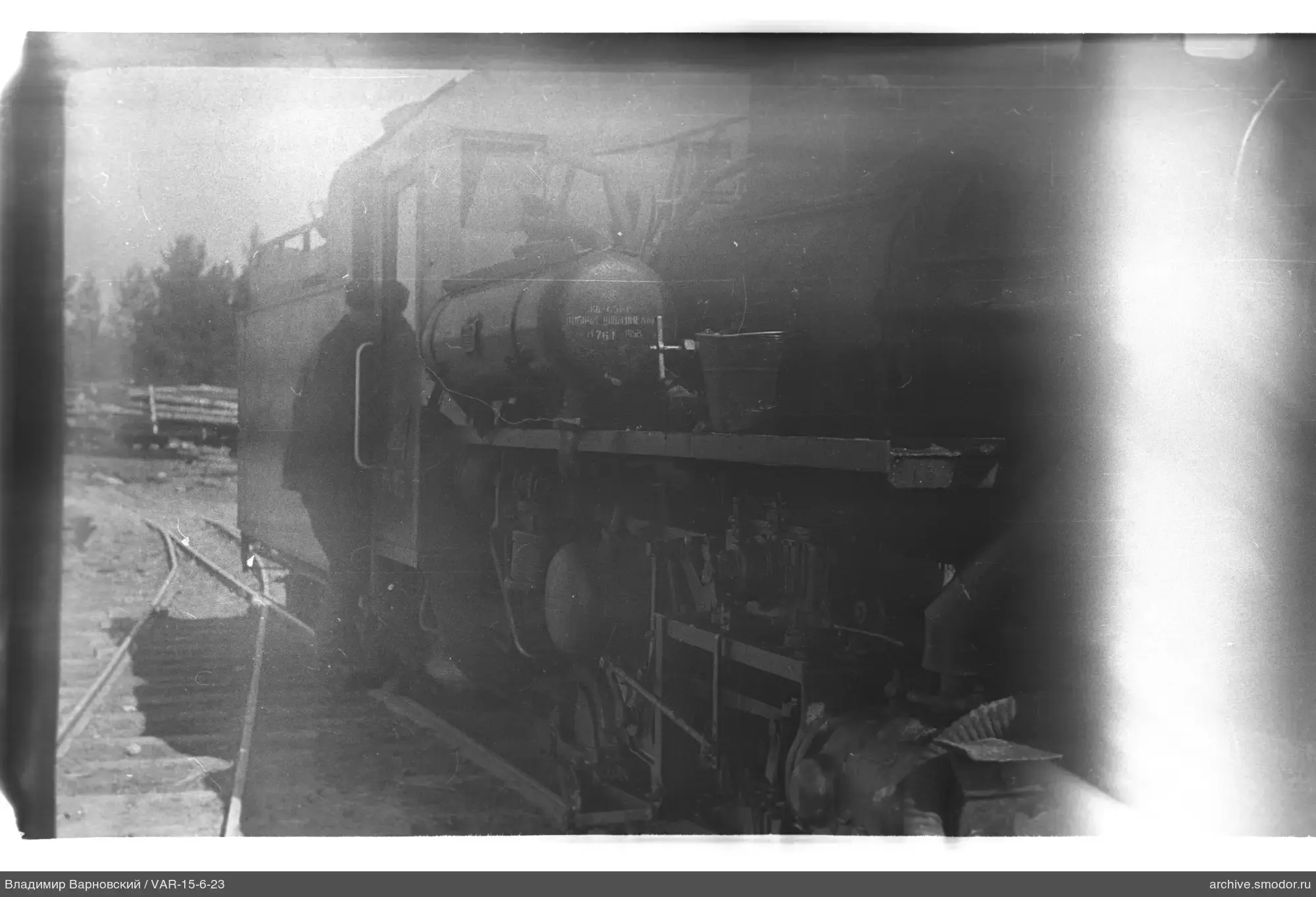 Steam locomotive with person on railway tracks