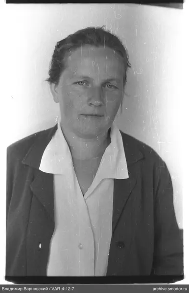 Portrait of a woman in a light shirt and dark jacket