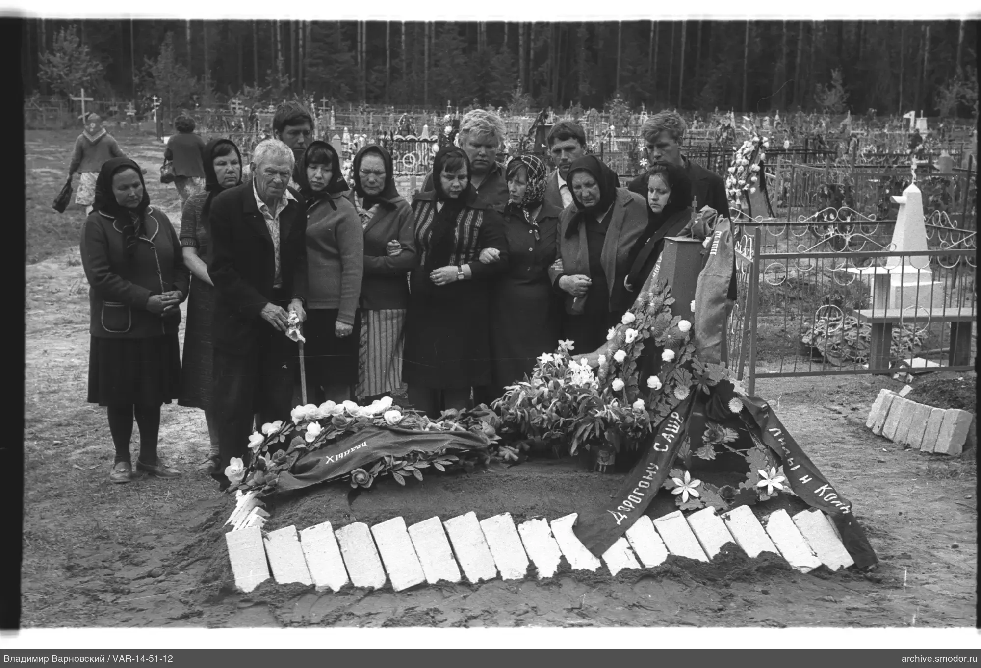 Group at a fresh grave
