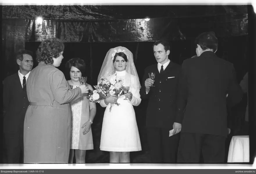 Group portrait with woman in wedding dress