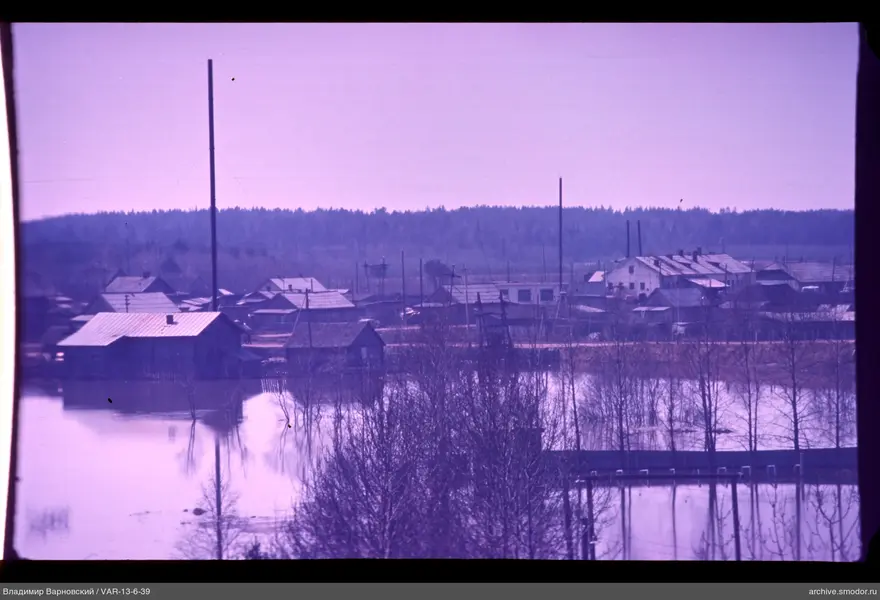 Wooden and brick houses by flooded area