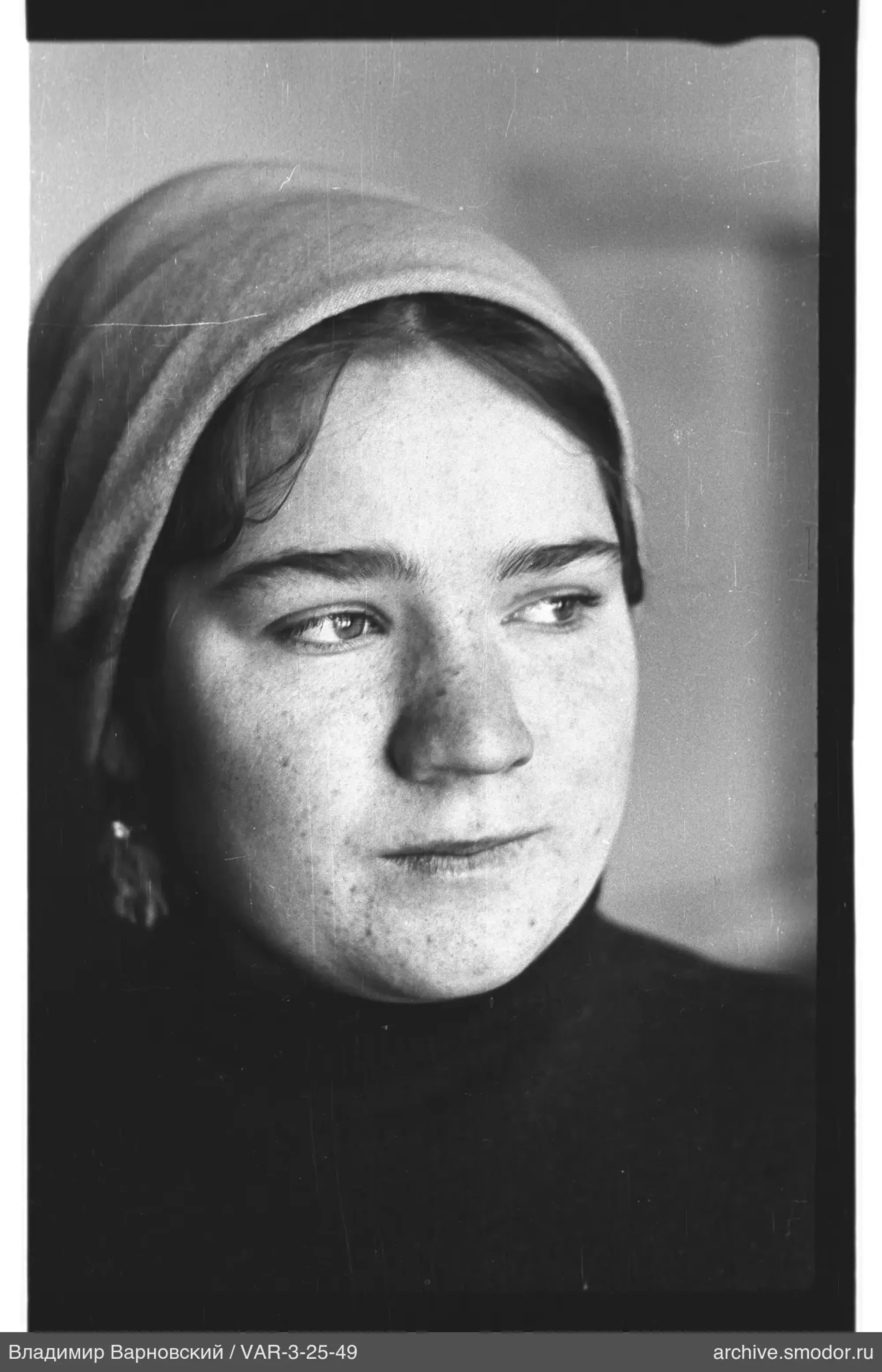 Portrait of a woman with headscarf and earring