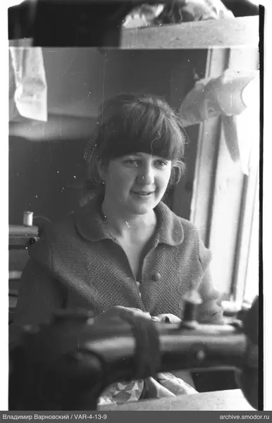 Portrait of a woman at a sewing machine