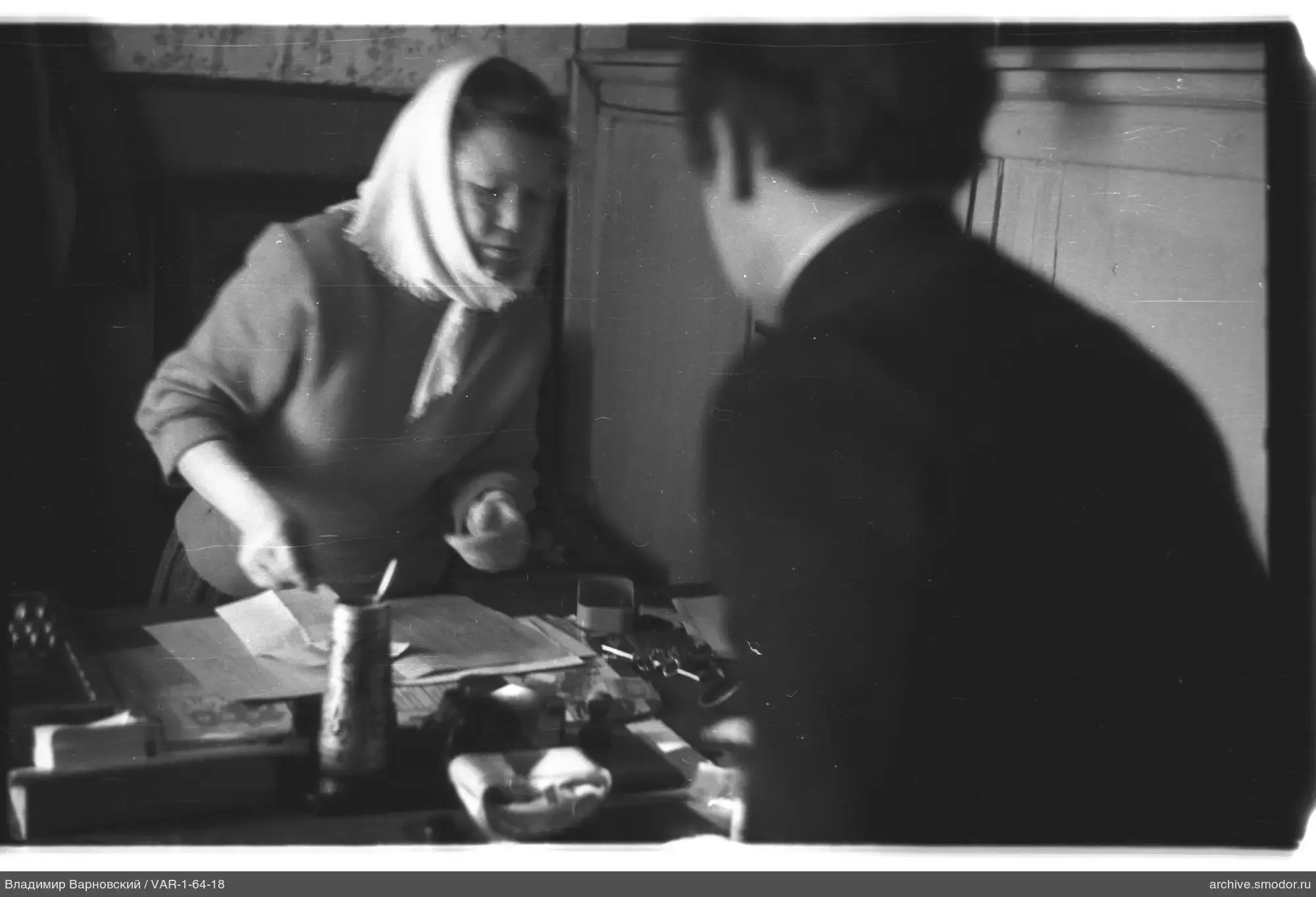 Woman with papers and man