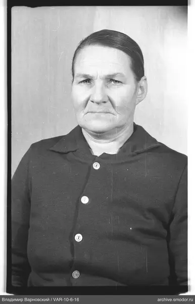 Portrait of a woman in a dark cardigan