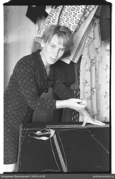 Woman at table with fabric and chalk