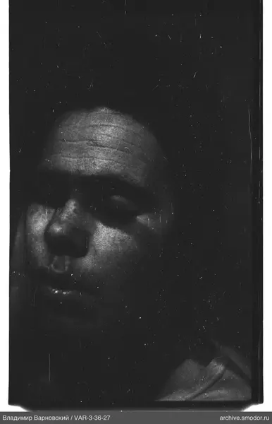 Portrait of a man against dark background