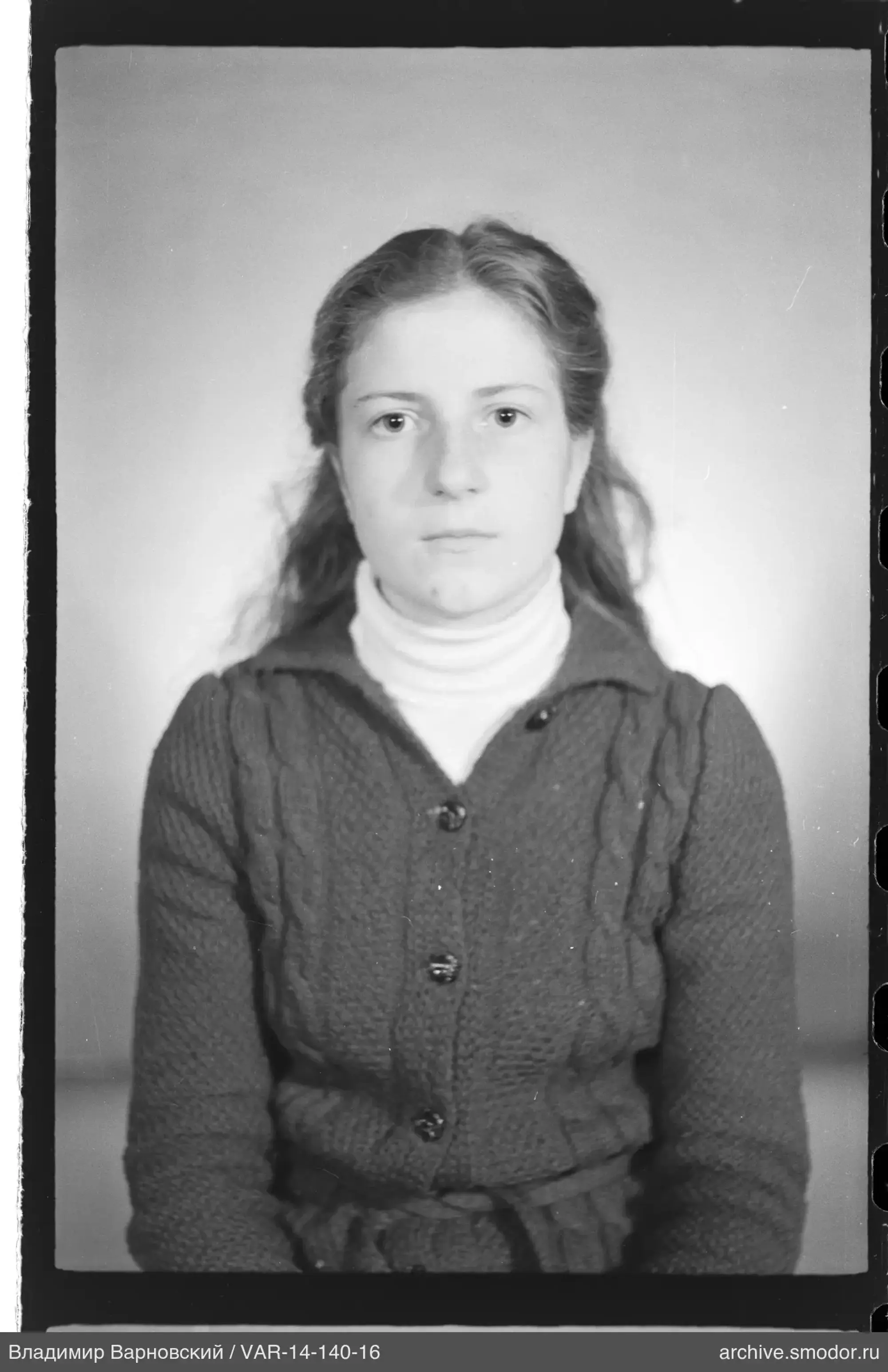 Portrait of a woman in a light turtleneck