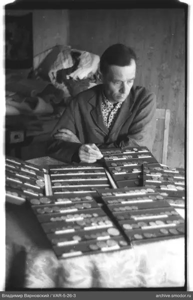 Man with coins at the table
