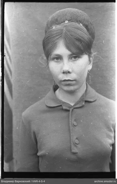 Portrait of a woman with a decorated bun