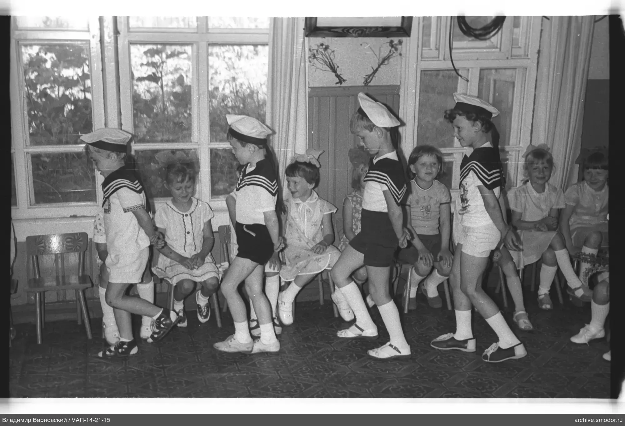 Group of children in a room with decorations