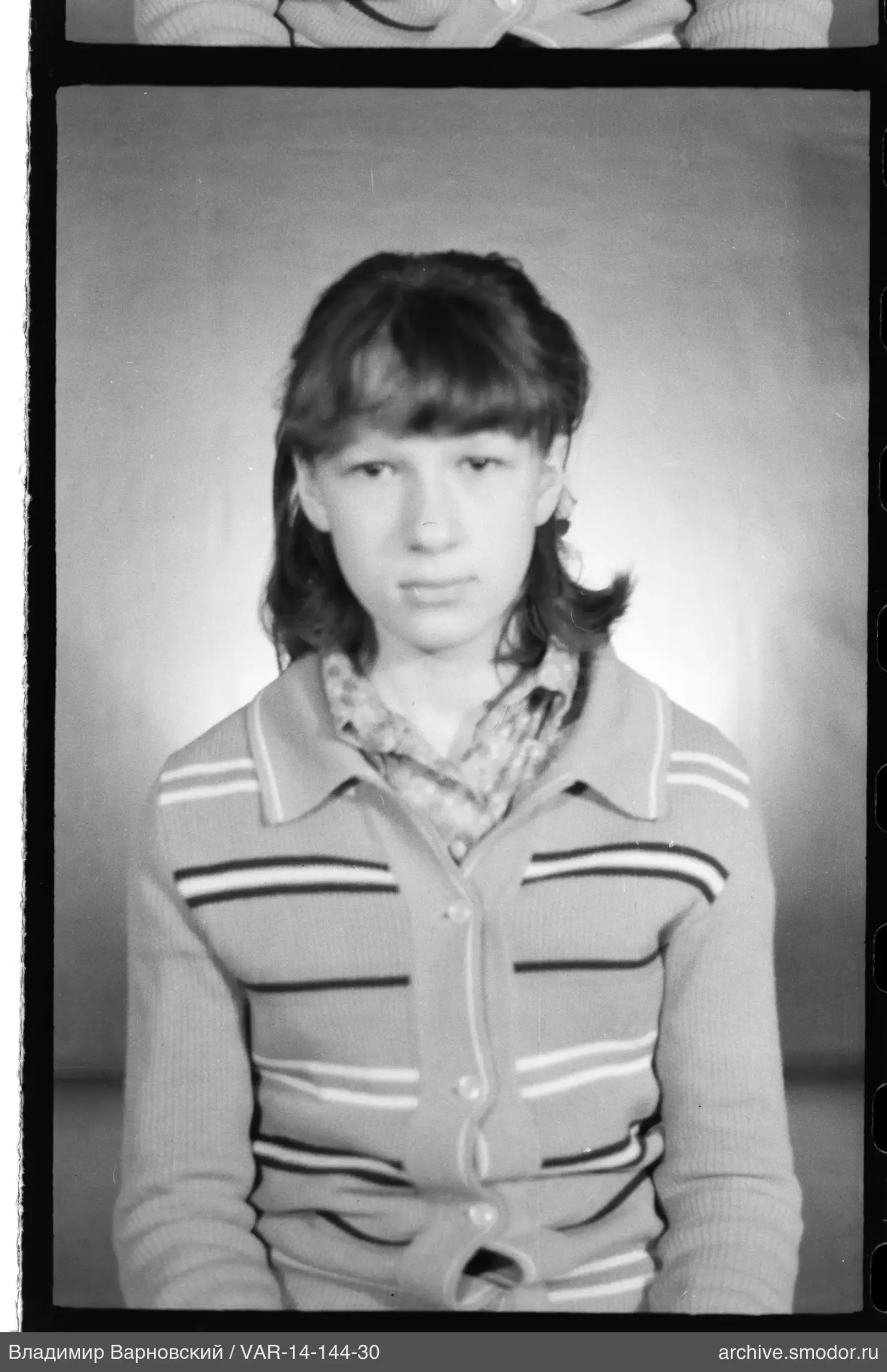 Portrait of a girl in a striped cardigan
