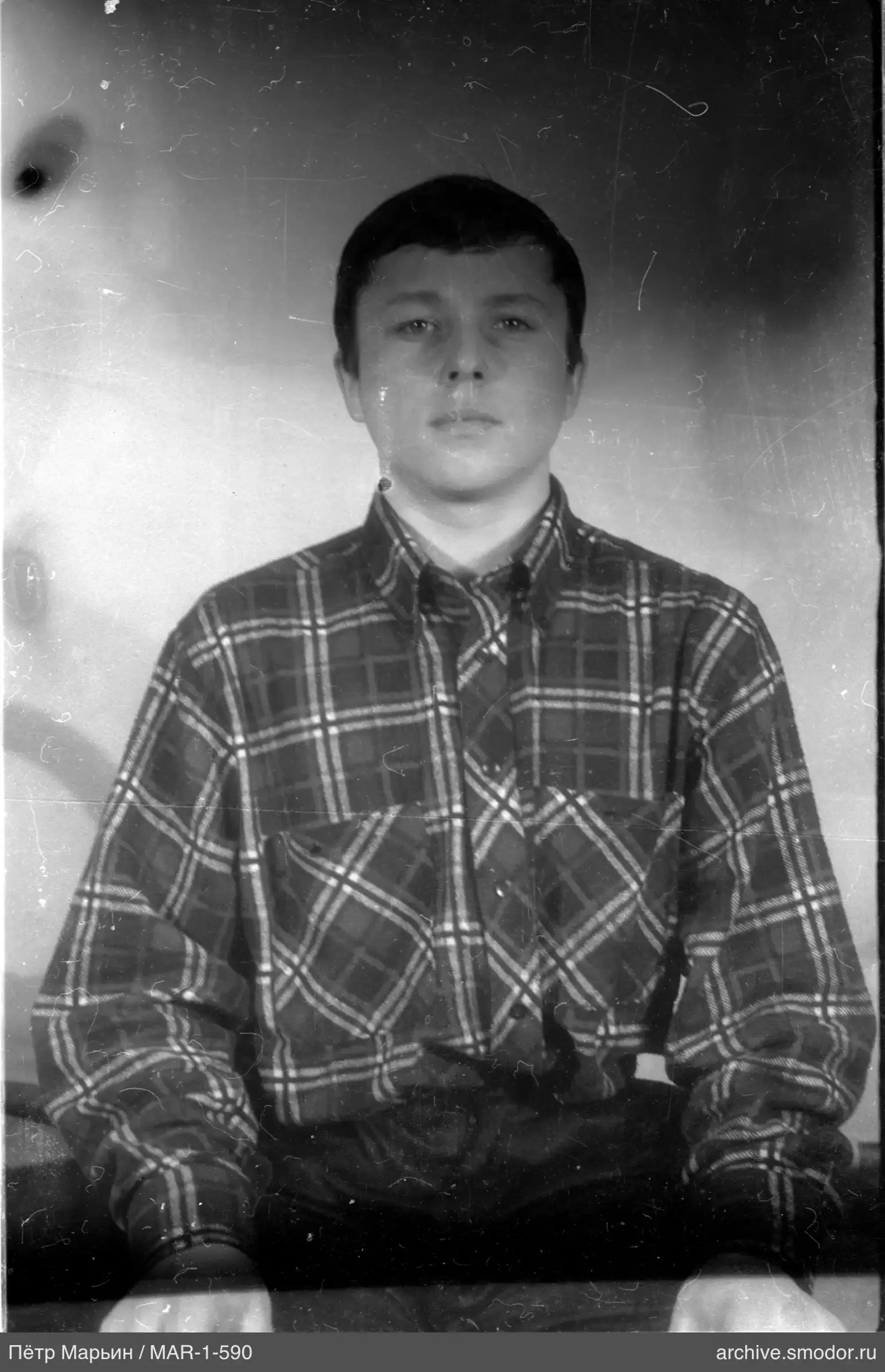Portrait of a man in a checkered shirt