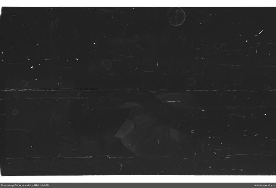 Faint silhouette against dark background