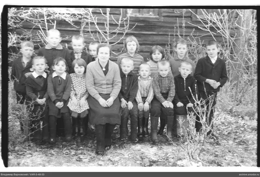 Group portrait of children and woman
