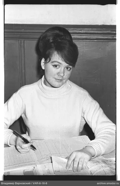 Portrait of a woman at a table