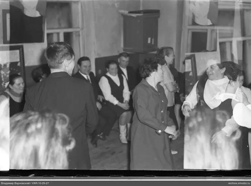 Group of people in a room with paintings