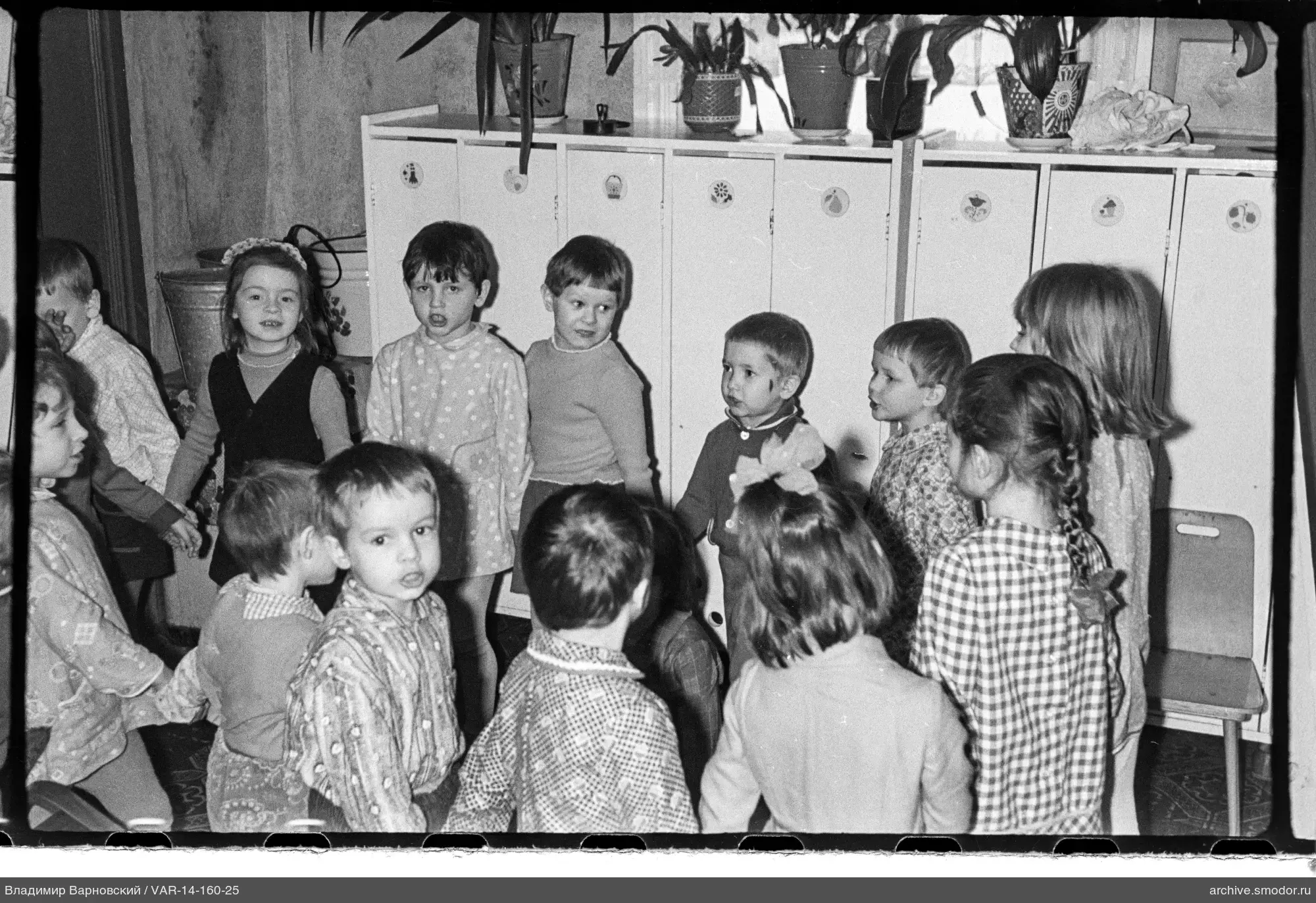 Group portrait of children in a room